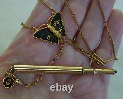 Collier mécanique avec un crayon à mine en plaqué or antique et un papillon en damasquinage japonais.